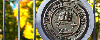 U of I seal on iron gate