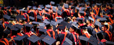 Pack of UIC graduates in caps and gowns