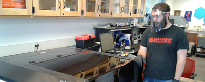 Dylan Lunch, assistant director for the UIC Engineering MakerSpace, produces face shields to supply to the University of Illinois Hospital.
